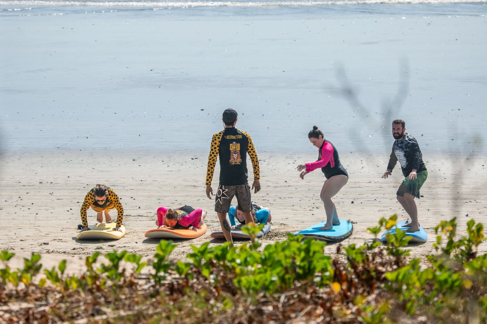 Group surf lesson on the sand with Chelo instructor