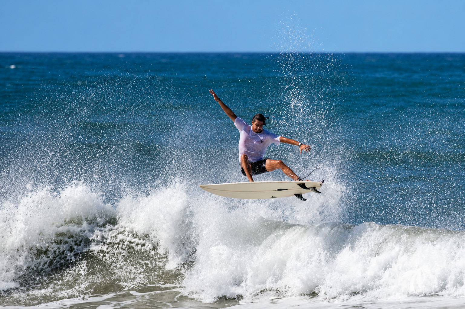 Chelo surfing an aerial maneuver