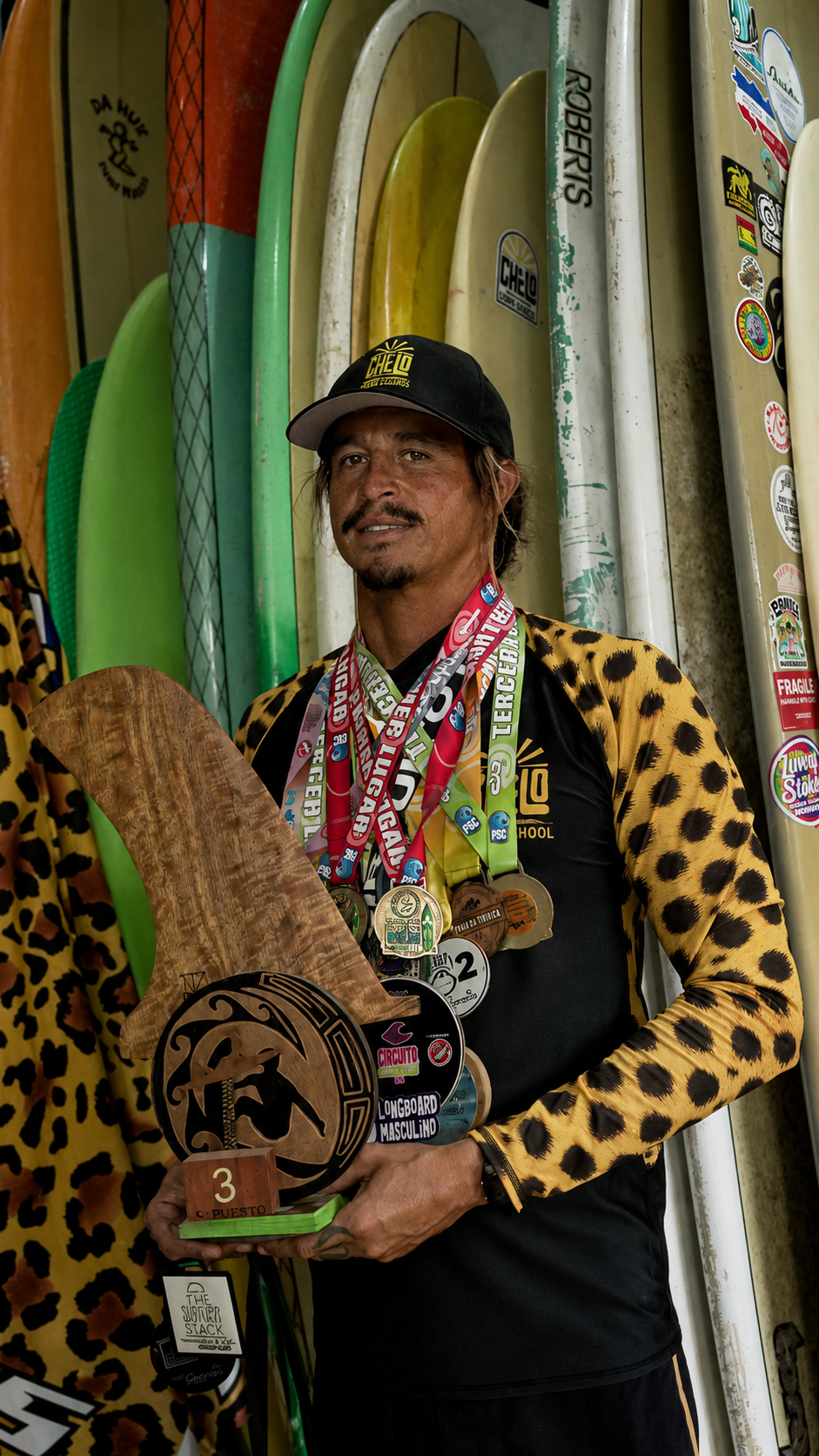 Chelo with competition medals and trophy
